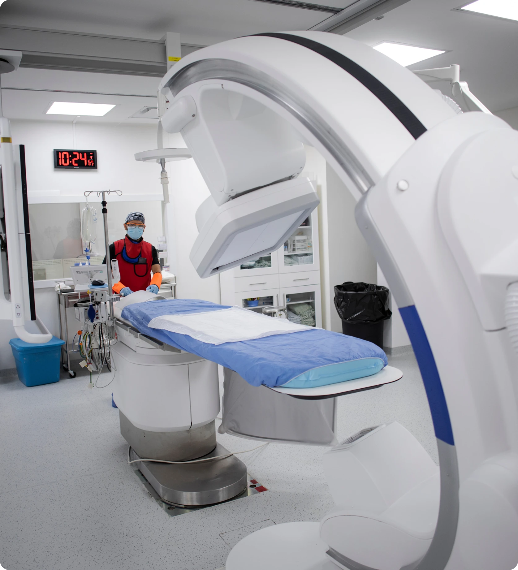Medical imaging room with advanced equipment setup.